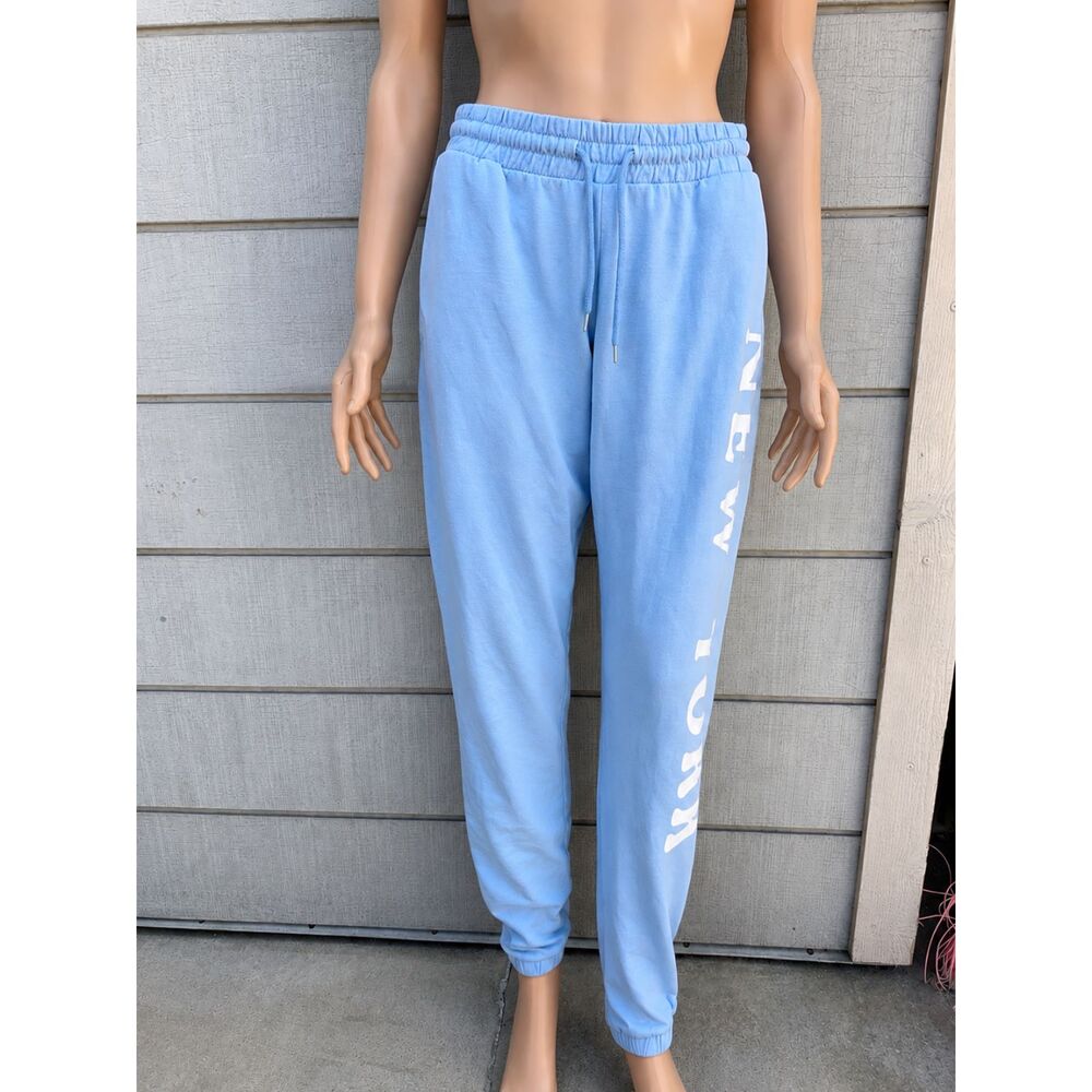 Woman’s Rebellious One Light Blue Fleece Joggers with White Script Logo size S